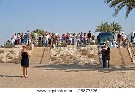 LUXOR, EGYPT - JULY 18, 2010: Group of tourists are looking at Colossi of Memnon at Luxor, Egypt. Luxor is a city in Upper (southern) Egypt and the capital of Luxor Governorate