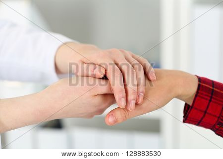 Friendly Female Doctor Hands Holding Woman Patient Hand