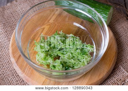 Grated cucumber on dish on the table