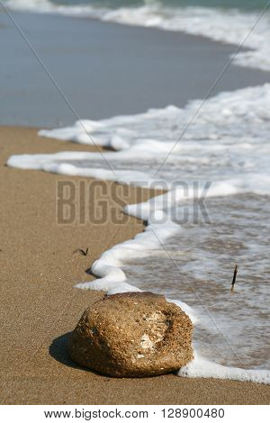 white waves and stone near the sea