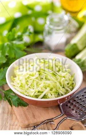 grated vegetable marrow in a bowl on table