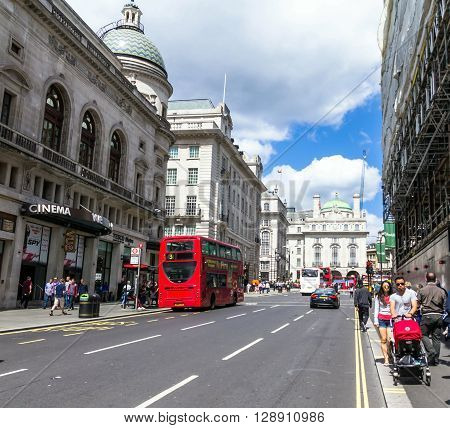 LONDON UK - JUNE 7 2015:Unidentified people at  Regent's street . It was named after Prince Regent completed in 1825. Every building in Regent Street is protected as a Listed Building.