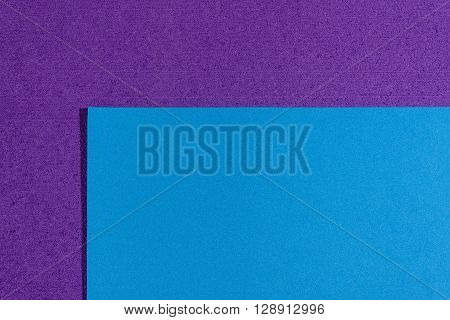 Eva foam ethylene vinyl acetate smooth blue surface on purple sponge plush background