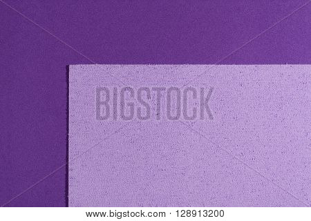 Eva foam ethylene vinyl acetate sponge plush light purple surface on purple smooth background