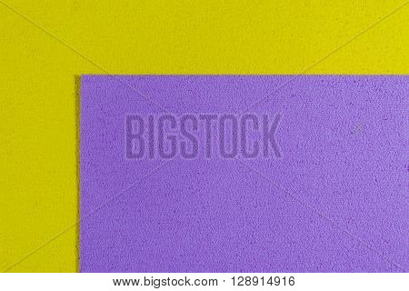 Eva foam ethylene vinyl acetate light purple surface on lemon yellow sponge plush background