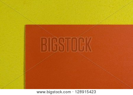 Eva foam ethylene vinyl acetate smooth orange surface on lemon yellow sponge plush background