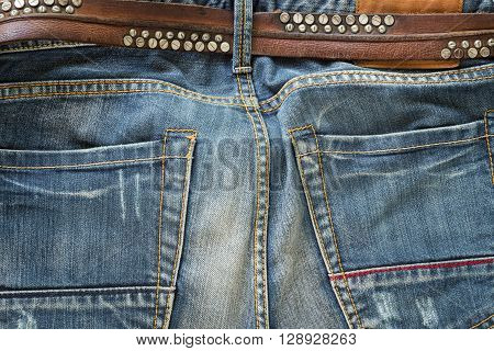 blue jeans with brown leather belt, clothing industry