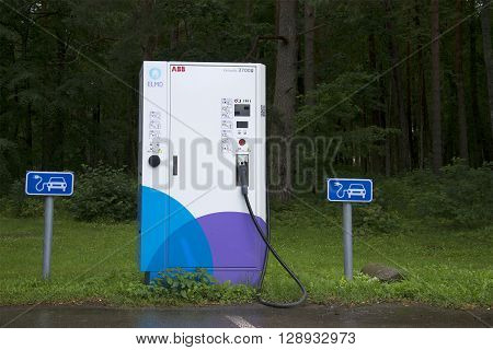 PADISE, ESTONIA - AUGUST 01, 2015: The electric vehicle charging point in the Parking area in Padise. An alternative source of gasoline. Environmental program