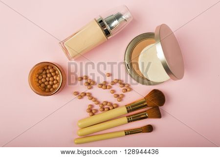 Makeup Essentials On A Pink Background