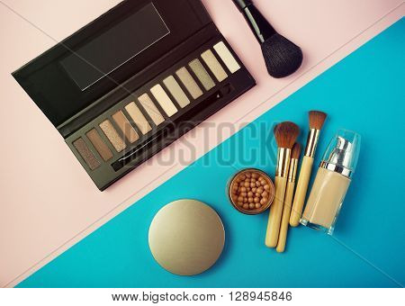 Makeup Essentials On A Pink Background