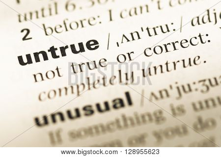 Close Up Of Old English Dictionary Page With Word Untrue.