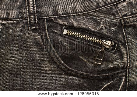 gray jeans pocket with zip lock closeup