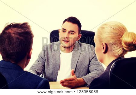 Business meeting-three people sitting and talking