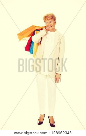 Happy business woman holging shopping bags