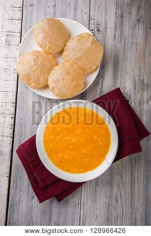 Aamras or Aam Ras Puri: Puri which is an indian fried small bread and alphonso mango pulp is a popular lunch especially during Padwa, the Marathi new year, maharashtrian lunch/dinner menu