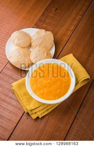 Aamras or Aam Ras Puri: Puri which is an indian fried small bread and alphonso mango pulp is a popular lunch especially during Padwa, the Marathi new year, maharashtrian lunch/dinner menu