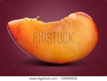 A Slice of Fresh Red Plum on Red Background.