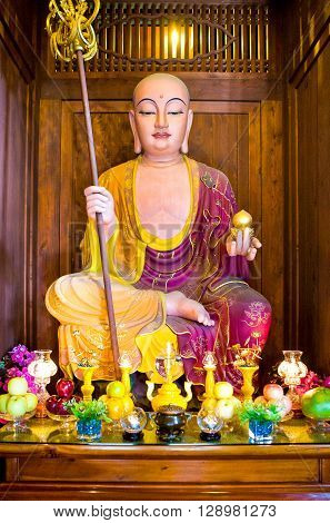 Hong Kong China - September 26 2007: A colored Buddah statue in the Chi Lin antique monastry in the new Kowloon quarter