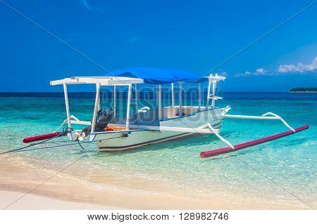 traditional Indonesia boat Jukung on a tropical beah