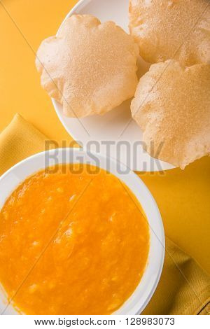Aamras or Aam Ras Puri: Puri which is an indian fried small bread and alphonso mango pulp is a popular lunch especially during Padwa, the Marathi new year, maharashtrian lunch/dinner menu