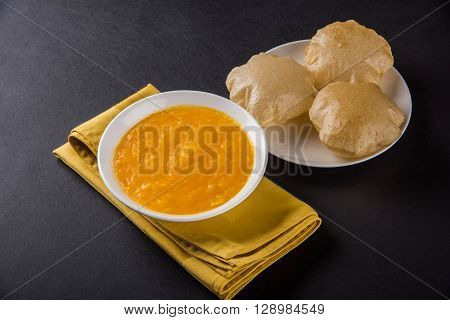 Aamras or Aam Ras Puri: Puri which is an indian fried small bread and alphonso mango pulp is a popular lunch especially during Padwa, the Marathi new year, maharashtrian lunch/dinner menu