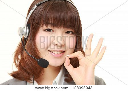 young Japanese business woman showing perfect sign