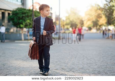 Concept Future Businessman. Business Meeting. Low Angle Of Future Businessman In Formal Wear Walking