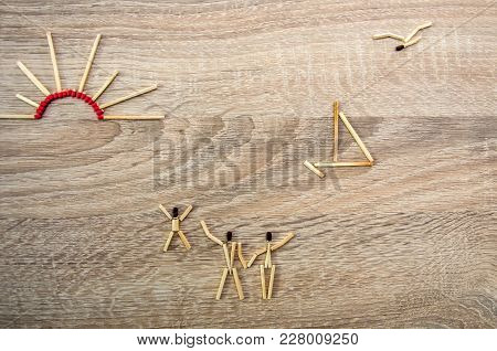17.08 025. Happy Family On The Beach. The Image Of Matches On A Wooden Texture.