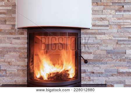 A Interior Shot Of A Modern Marble Fireplace In Living Room