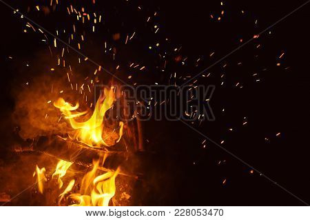 Night Bonfire With Sparks. Fire Background With Copyspace