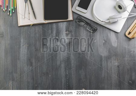 Top View Of Contemporary Wooden Tabletop With Copy Space And Various Items. Work Place And Style Con