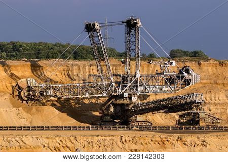 Huge Bucket Wheel Excavator Mining For Brown Coal In An Open Pit Mine.