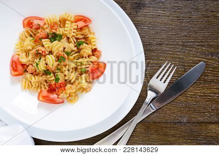 Warm Salad With Seafood In A White Bowl On A Wooden Background. Pasta Radiatori With Crayfish, Shrim