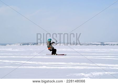 Perm, Russia - February 23, 2018: Snowkiter Glides On The Ice Of The Kama Reservoir