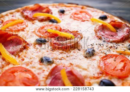 Close Up Texture Of Delicious Sicilian Pizza With Bacon, Olives And Tomatoes, Food Background