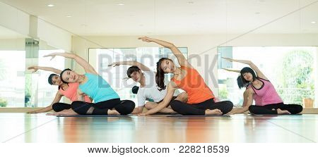 Group Of Asian Women And Man Practicing Yoga, Fitness Stretching Flexibility Pose, Working Out, Heal