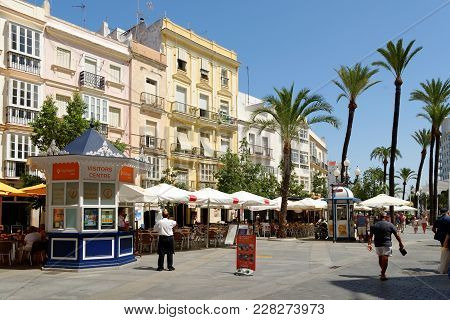Cadiz, Spain - August 31, 2017: Tourists Relaxing At Pavement Cafes On Plaza San Juan De Dios In Cad