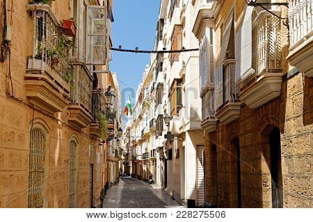 A Typical Old Narrow Street In The Historical Town Of Cadiz, Spain