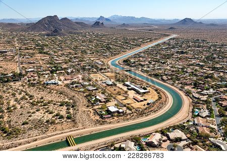 Helicopter View Of Irrigation Water Flowing Through A Scottsdale, Arizona Suburb Looking To The Sout