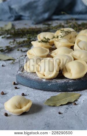 Dumplings With Pork Handmade On A Blue Background. National Food. Semifinished. Ravioli