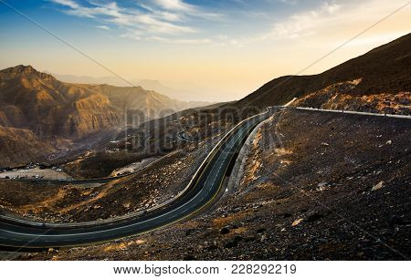 Jabal Jais Mountain Road At Sunset. The Highest Mountain In United Arab Emirates