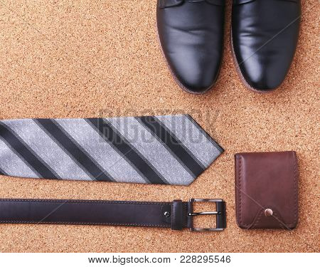 Gadgets And Accessories For Men On Light Wooden Background. Fashionable Men S Belt, Wallet, Lighter,