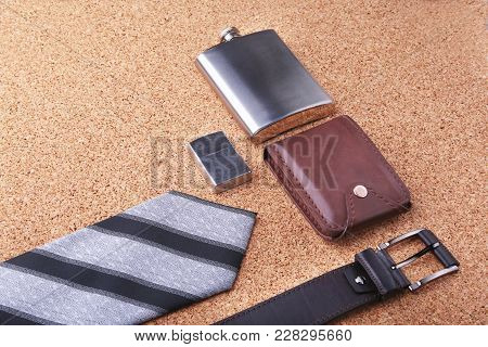 Gadgets And Accessories For Men On Light Wooden Background. Fashionable Men S Belt, Wallet, Lighter,