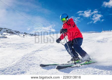 Man Skiing On The Prepared Slope With Fresh New Powder Snow In Tyrolian Alps, Zillertal, Austria
