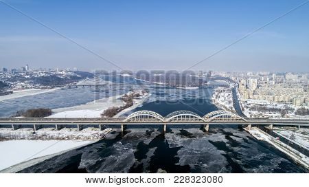 Aerial View Of The City, Ukraine. Dnieper River With Bridges. Darnitskiy Bridge. Combined Railway An