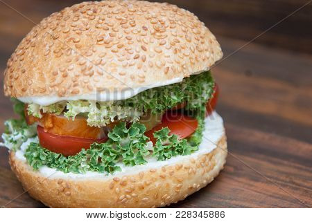 Homemade Hamburger With Fresh Letuce Leaves, Tomatoe Slice, Meat. Homemade Healthy Food Or Fast Food