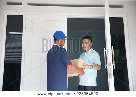 Delivery Service Male Sending Package To Client House