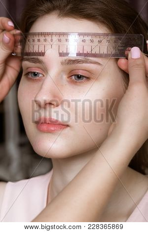 Permanent Microblasting Tattooing Freckles To A Woman In A Beauty Salon.