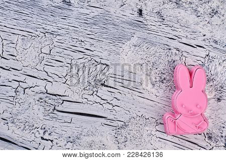 Silicone Mold For Baking, Copy Space. Pink Rabbit Shaped Silicone Mold Form For Cakes On Grey Textur