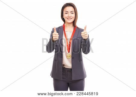 Young Businesswoman Wearing Golden Medal On Red Ribbon